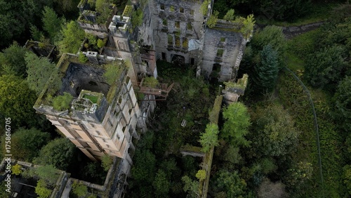 Low level aerial image over a derelict castle on a bright sunny spring day on the rural landscape of central Scotland. 
