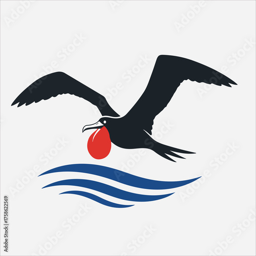 Silhouette of a Magnificent Frigatebird Soaring Above Blue Ocean Waves.