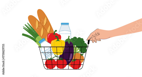 A person's hand placing groceries into a shopping basket.