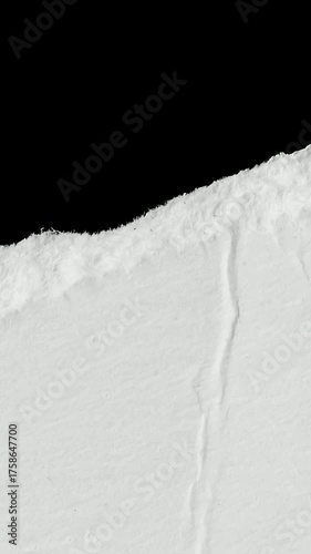 a white piece of paper on a black isolated background