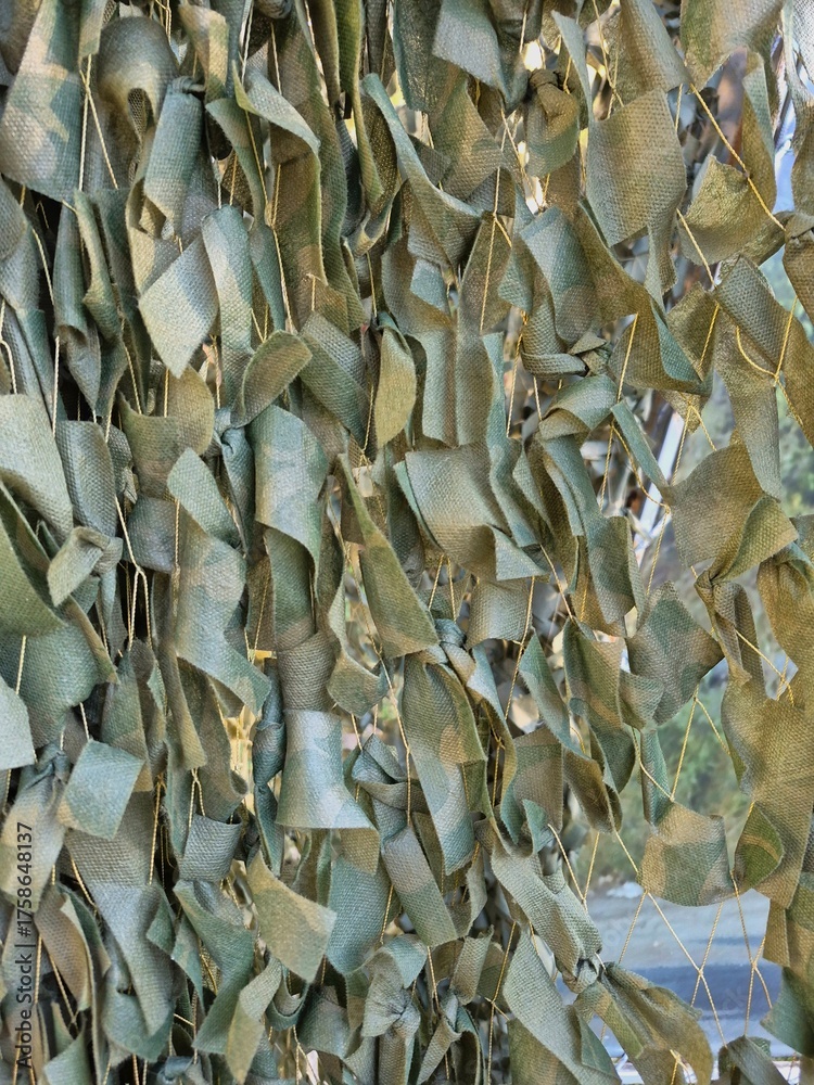 Naklejka premium Camouflage netting for military equipment