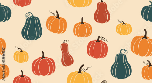 A charming collection of pumpkins and gourds in autumnal hues celebrating the fall season.