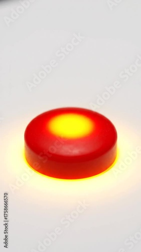 Glowing red disc illuminated on white background for visual communication