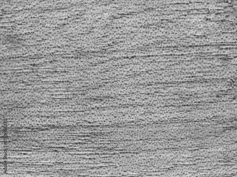 Fototapeta premium This is a beautifully textured gray surface that features subtle and intricate patterns