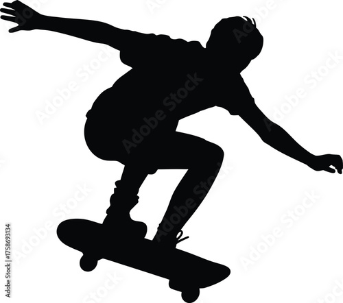 Skateboarder performing aerial trick silhouette