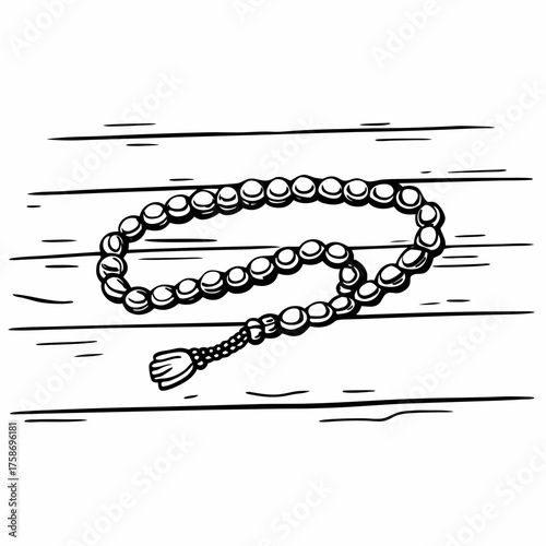 Illustration of a rosary with round beads and a tassel resting on a wooden surface with line details
