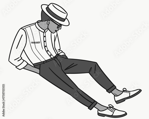 A man in a hat and sunglasses is sitting with his hands in his pockets