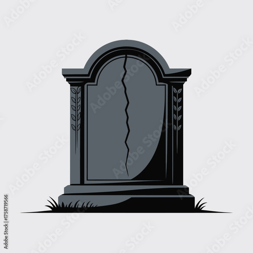 A cracked dark gray tombstone with a rounded top and grass at the base