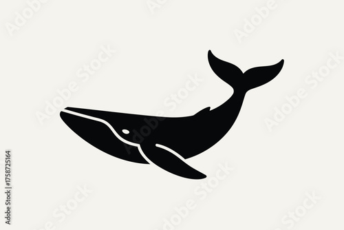 Simple black silhouette of a whale with a tail fluke up