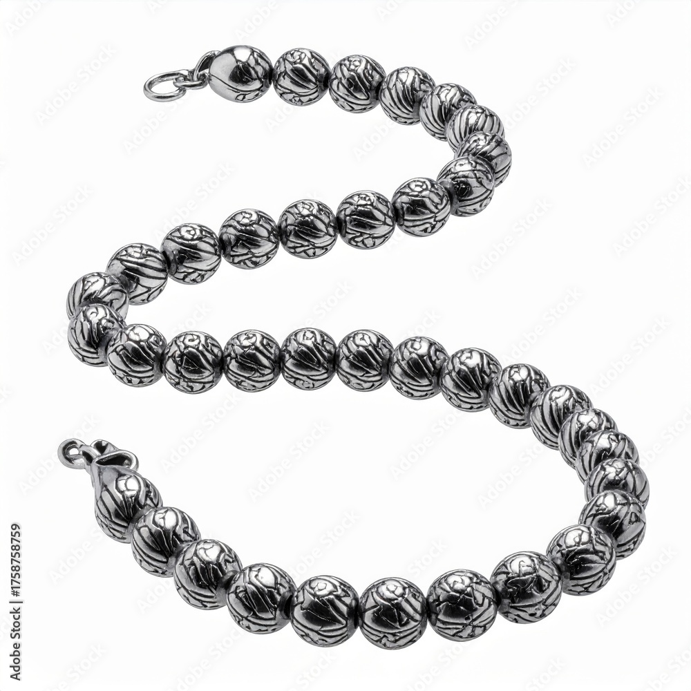 Obraz premium Elegant Silver Ball Bracelet Jewelry with Intricate Pattern on White Surface