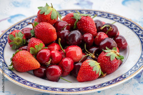 Fresh ripe red fruits and berries, cherry and strawberry, healthy food
