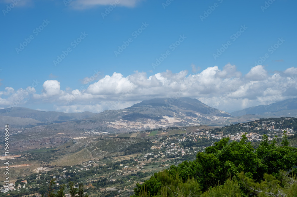 Naklejka premium View from heights of Erice to scenic coastal roads, olive groves, panoramic view on Riserva Naturale Orientata Monte Cofano and Mediterranean sea, travel destination in Italy