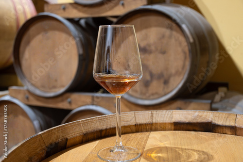 Photos Visit of wine cellar with old large oak barrels, glass of fortified dry or sweet