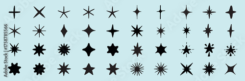 Collection of 40 black star shapes on a light blue background. Various star designs include starbursts, star outlines, and abstract stars. Star shapes for design use. Element vector set.