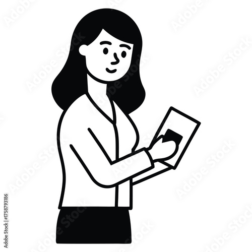 Smiling businesswoman standing and working on a laptop computer in a professional office