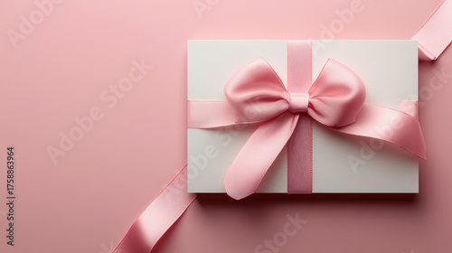 Gift certificate mockup featuring a pink ribbon and bow on a pink background, creating a festive atmosphere perfect for Christmas or Valentine's Day promotions