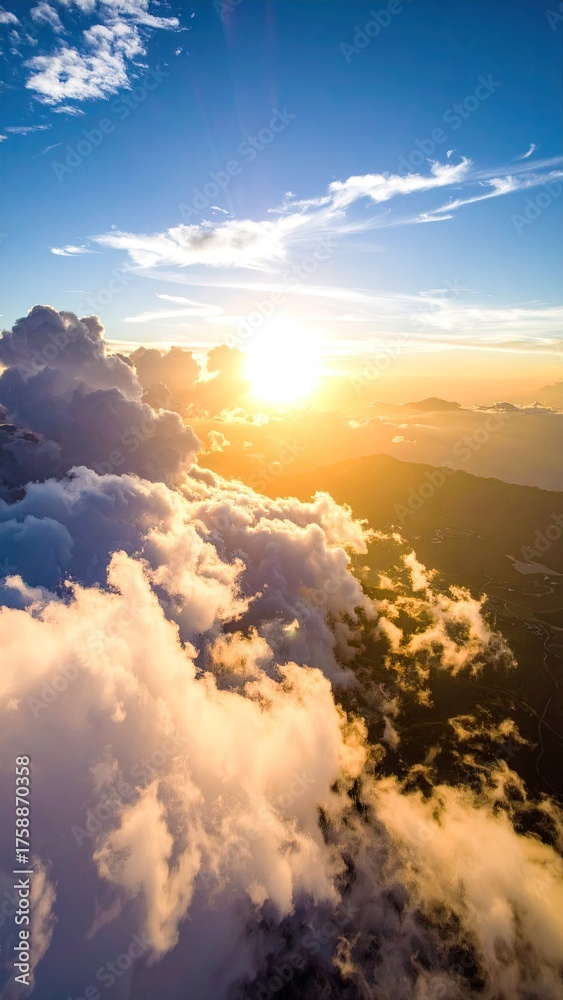 Fototapeta premium Aerial View of Sunrise Above Clouds