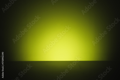 Abstract yellow green glow emerging from darkness, minimalist futuristic light horizon background