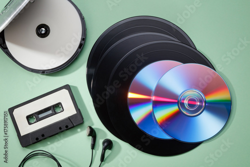 Collection of vintage retro vinyl records, Audio cassette tape, CD disk and player. Retro acoustic. Saving data, music, movies, videos. Vintage media concept. Top view. 