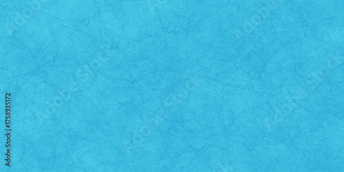 Vintage rough blue paper texture with abstract grunge pattern wall design and aged blank canvas backdrop