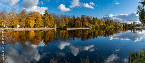 A colorful autumn panoramic landscape with Kolonistsky Pond in Otdelny Park. Pushkin, Saint Petersburg, Russia.