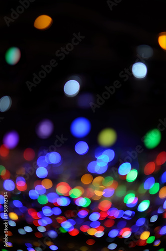 Abstract of blurry, colored lights of holiday illumination