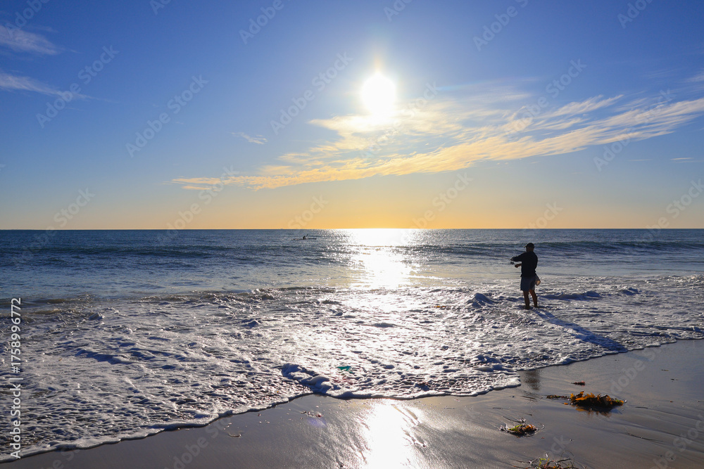 Fototapeta premium man fishing on beach