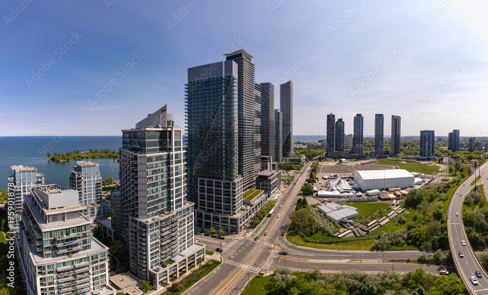 Obraz premium Aerial view of Marine Parade Drive and Lake Shore Boulevard West in Etobicoke near Toronto West downtown, Ontario. Mimico neighbourhood. Lake Ontario waterfront and residential housing developments.