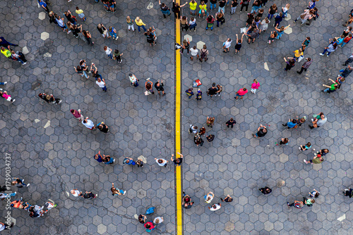 Fotografie Urban Patterns from Above
Aerial view of people standing and walking on a paved