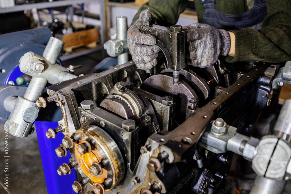 Fototapeta premium Process of assembling or repairing engine, close up