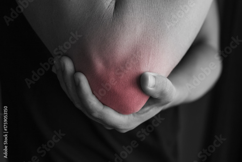 Εκτύπωση καμβά Man with elbow injury showing red highlights pain relief concept concept muscle