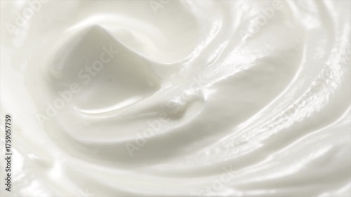Sour cream or greek yogurt swirl, rotating texture, White cream background, close up. Dairy product. Delicious organic creamy yogurt. Milk cream. Top view, Macro shot.