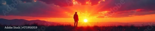 Silhouetted Figure at Sunset Contemplation and Solitude in Vast Nature