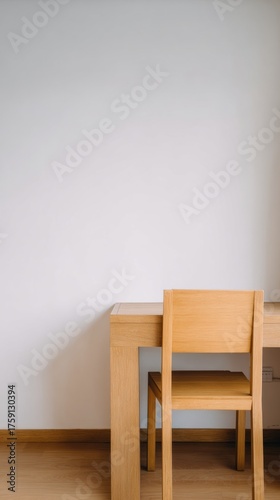 organized. A clean and simple office corner featuring a wooden desk and chair...