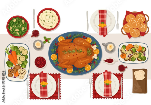Thanksgiving table with turkey sides and place settings overhead view