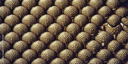 A textured background featuring a hexagonal pattern created with many spiky durian fruits arranged closely together.