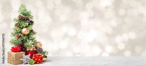 Christmas Tree with Gifts and Decorations on Bokeh Background.