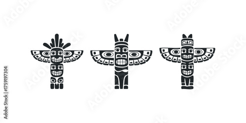 Three stylized totem poles with carved faces