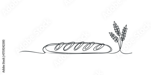 Loaf of bread with wheat stalks