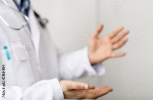 Doctor in white coat presen...