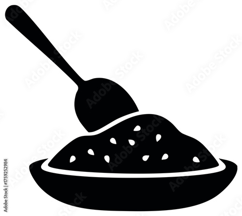 Spoon in a bowl of granular food black icon symbol vector graphic