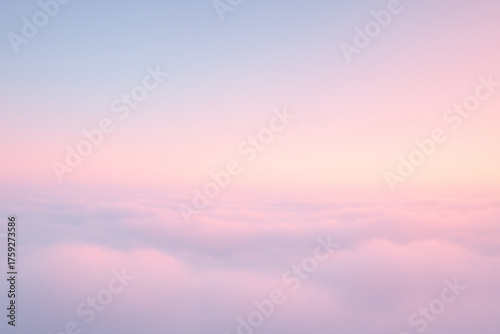Dreamy pastel horizon above the clouds with soft pink and blue light