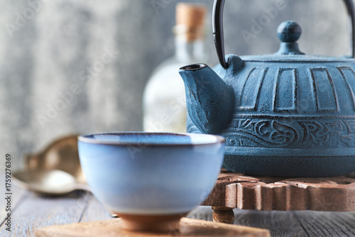 Japanese Cast Iron Teapot on bright background.	