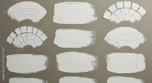 Texture brush strokes and fan shapes created with white paint on a gray background revealing artistic techniques and creative applications