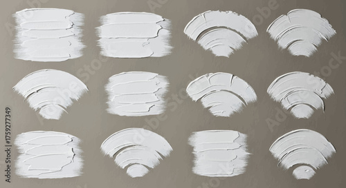 Collection of White Brush Strokes and Textured Paint Smears on Neutral Background Demonstrating Artistic Application Techniques
