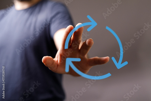 Hand reaching towards a cir...