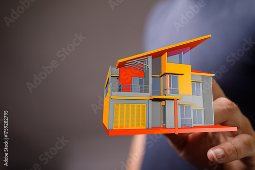 A hand presenting a 3D mode...