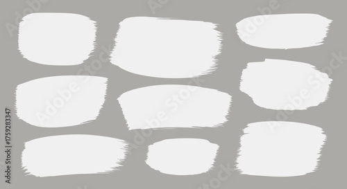 Abstract White Paint Brush Strokes on a Neutral Gray Background Representing Art and Design Elements for Creative Projects