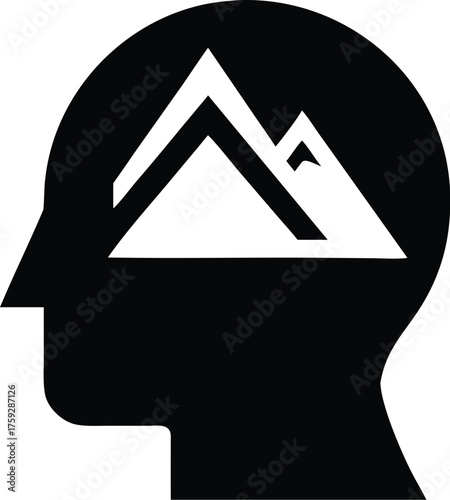 Silhouette of a human head with mountains inside
