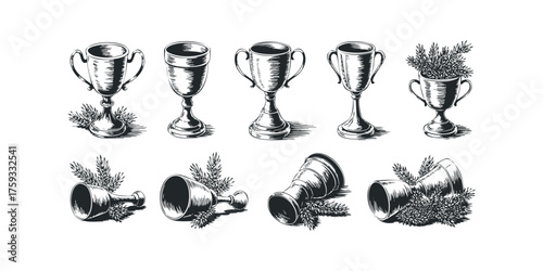 Collection of vintage goblets and trophies with foliage